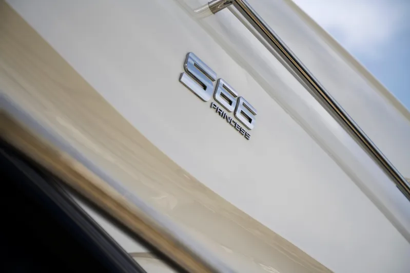  Yacht Photos Pics 2021 Princess S66 yacht emblem on sleek white exterior.