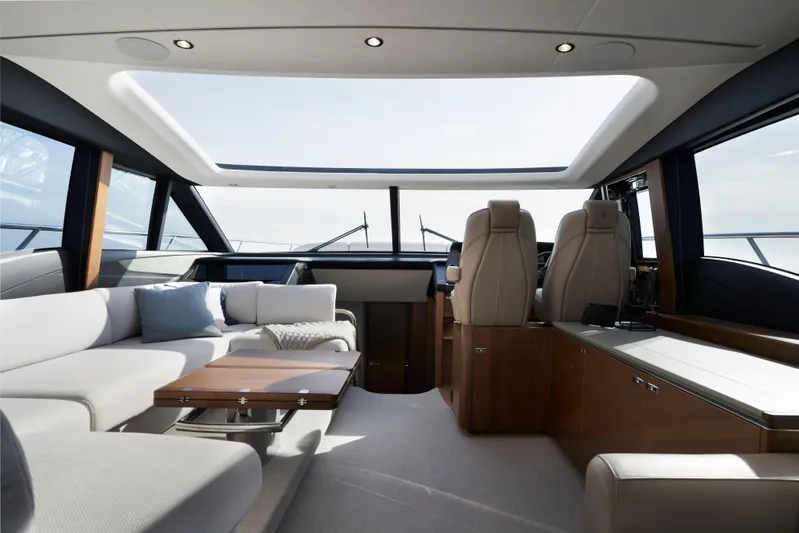  Yacht Photos Pics Luxurious interior of 2021 Princess S66 yacht with modern seating and panoramic windows.