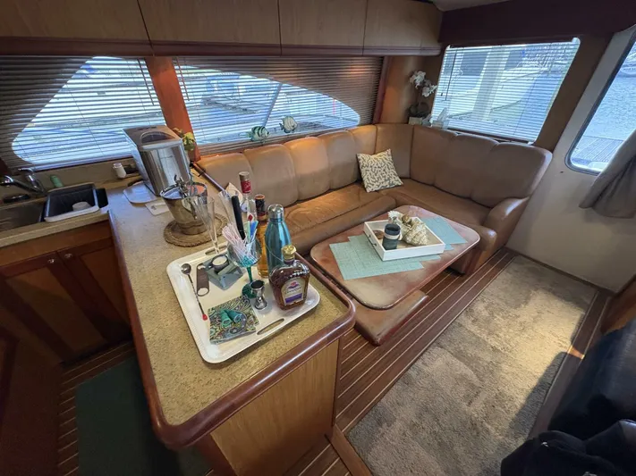 Rabbit Hole Yacht Photos Pics Interior of 2005 Luhrs 41 Convertible yacht with cozy seating and kitchenette.