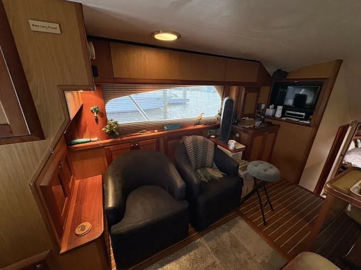 Rabbit Hole Yacht Photos Pics 2005 Luhrs 41 Convertible yacht interior with cozy seating and wooden accents.