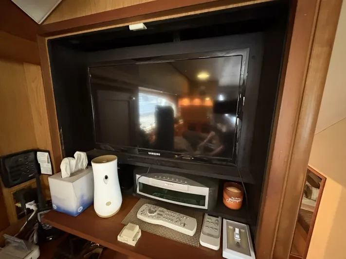 Rabbit Hole Yacht Photos Pics Entertainment center on 2005 Luhrs 41 Convertible yacht with TV and accessories.