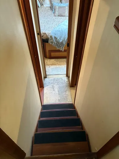 Rabbit Hole Yacht Photos Pics Stairway inside 2005 Luhrs 41 Convertible yacht leading to cabin area.