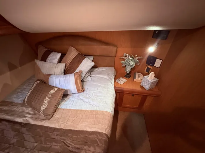 Rabbit Hole Yacht Photos Pics Luxurious cabin interior of 2005 Luhrs 41 Convertible yacht with cozy bedding and decor.