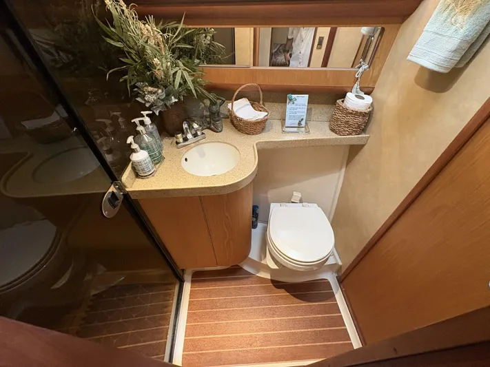 Rabbit Hole Yacht Photos Pics Luxurious bathroom in 2005 Luhrs 41 Convertible yacht with modern amenities and elegant decor.