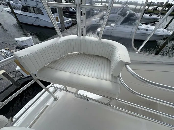 Rabbit Hole Yacht Photos Pics White seating on 2005 Luhrs 41 Convertible yacht, docked at marina.