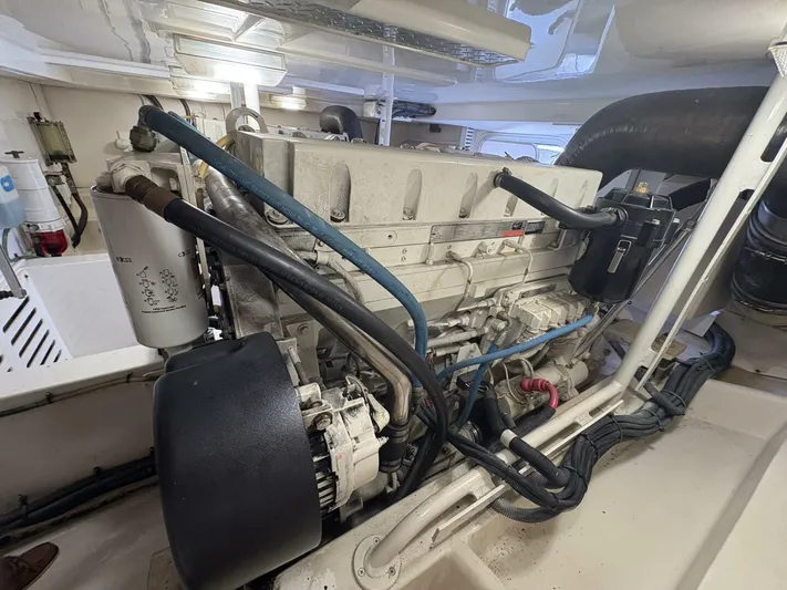 Rabbit Hole Yacht Photos Pics Engine room of 2005 Luhrs 41 Convertible boat, showcasing detailed machinery components.