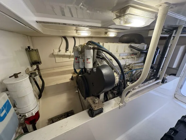 Rabbit Hole Yacht Photos Pics Engine room of 2005 Luhrs 41 Convertible boat, showcasing mechanical components and wiring.