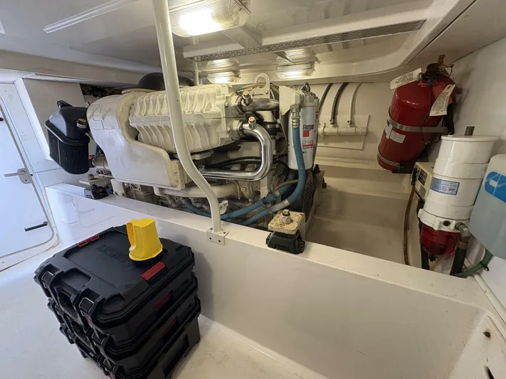 Rabbit Hole Yacht Photos Pics Engine room of 2005 Luhrs 41 Convertible boat, featuring equipment and storage.