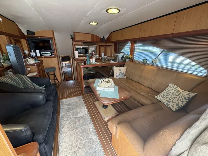 Rabbit Hole Yacht Photos Pics Luxurious interior of 2005 Luhrs 41 Convertible yacht with cozy seating and modern amenities.