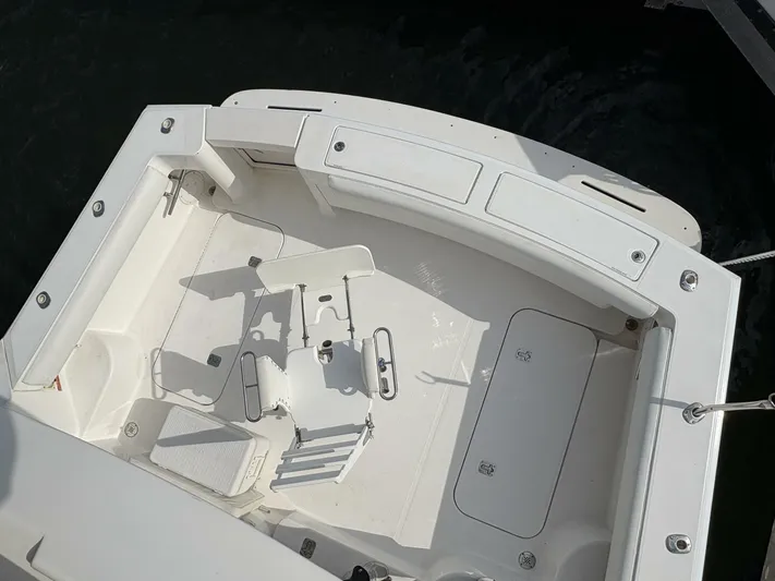 Rabbit Hole Yacht Photos Pics 2005 Luhrs 41 Convertible boat deck with seating and storage compartments.