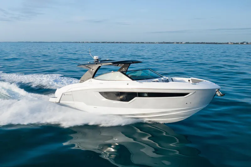  Yacht Photos Pics 2026 Cruisers Yachts 38 GLS OB cruising on open water, showcasing sleek design and performance.
