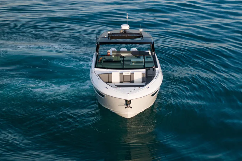  Yacht Photos Pics 2026 Cruisers Yachts 38 GLS OB on serene blue water, aerial view.