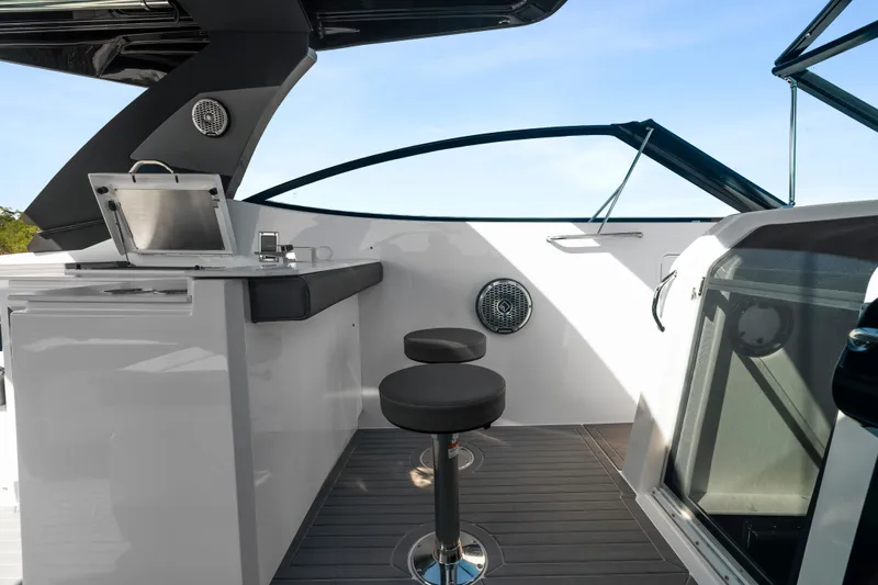  Yacht Photos Pics 2026 Cruisers Yachts 38 GLS OB interior with sleek bar and seating area.