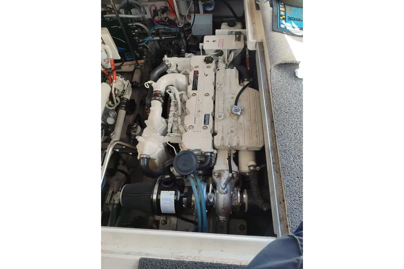  Yacht Photos Pics Engine compartment of a 2005 Sea Ray 425 Sundancer boat, showcasing mechanical components.