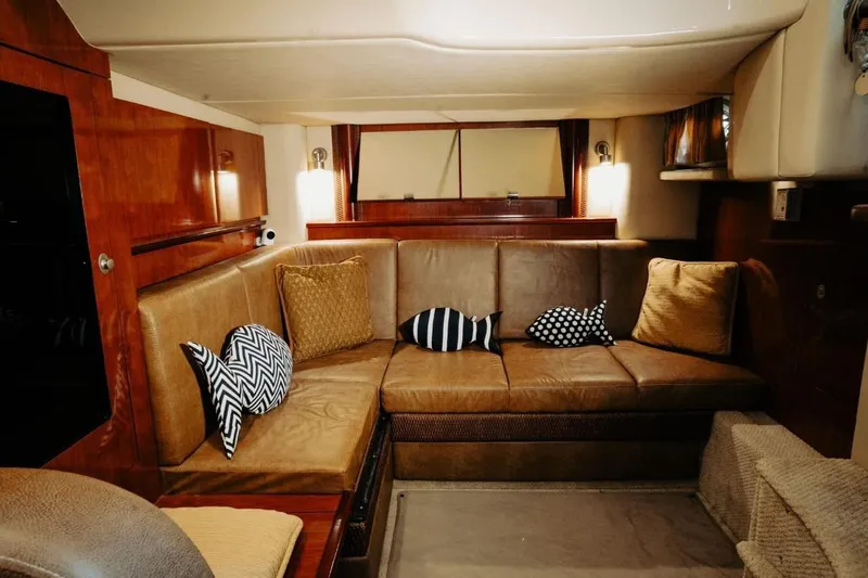  Yacht Photos Pics Luxurious interior of 2005 Searay Sundancer 390 yacht with plush seating and decorative pillows.