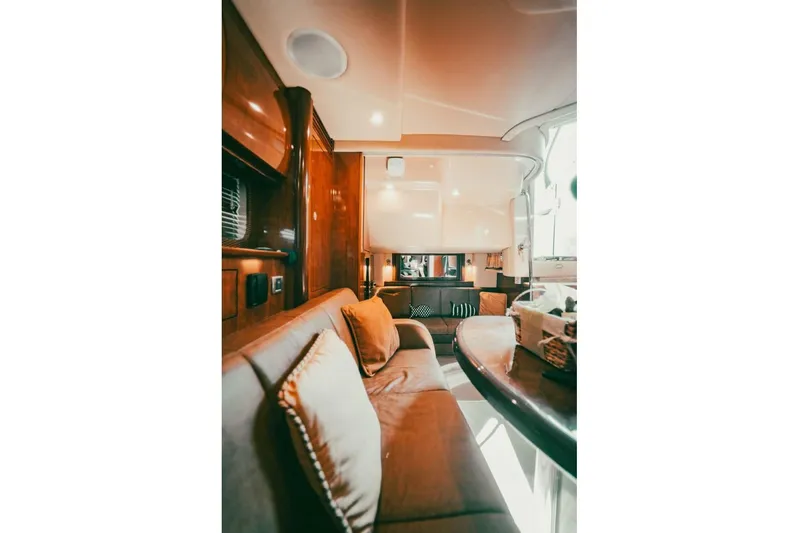  Yacht Photos Pics Luxurious interior of 2005 Searay Sundancer 390 yacht with plush seating and elegant design.