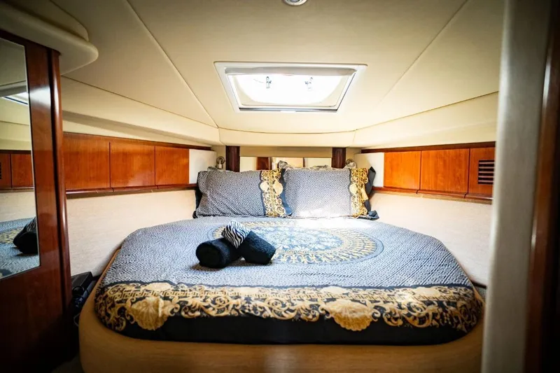  Yacht Photos Pics Luxurious cabin interior of 2005 Searay Sundancer 390 yacht with elegant bedding.