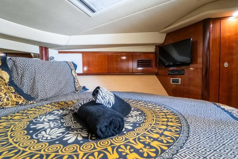  Yacht Photos Pics Luxurious cabin interior of 2005 Searay Sundancer 390 yacht with elegant bedding and TV.
