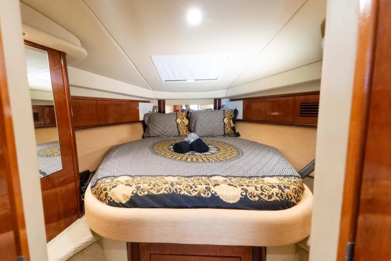  Yacht Photos Pics Luxurious cabin interior of 2005 Searay Sundancer 390 yacht with elegant bedding.