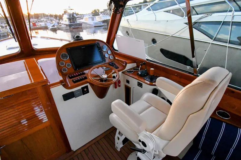 Annie Beau Yacht Photos Pics Helm of 2011 Hinckley Picnic Boat 37 MKIII with luxurious seating and navigation controls.