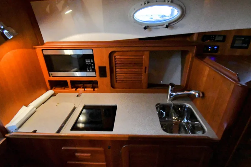 Annie Beau Yacht Photos Pics Hinckley Picnic Boat 37 MKIII 2011 galley with sink, stove, and microwave.