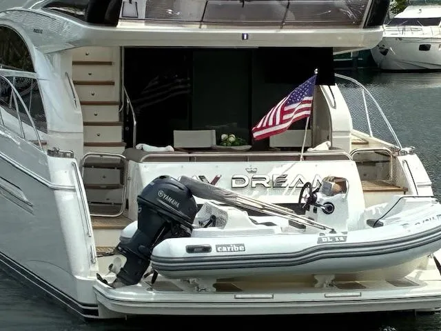 Mv Dream Yacht Photos Pics Luxury yacht "Viking Princess Fly" 2012 with American flag and dinghy at the stern.