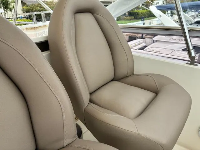 Mv Dream Yacht Photos Pics Luxurious seating on a 2012 Viking Princess Fly yacht, featuring plush beige upholstery.