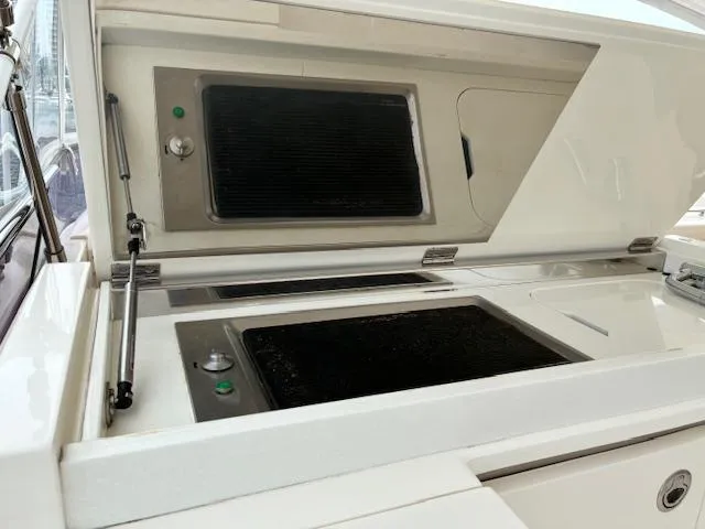 Mv Dream Yacht Photos Pics Outdoor grill on a 2012 Viking Princess Fly yacht, featuring dual cooking surfaces.