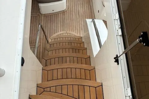 Mv Dream Yacht Photos Pics Elegant wooden staircase on 2012 Viking Princess Fly yacht interior.