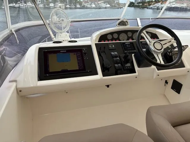 Mv Dream Yacht Photos Pics Cockpit of 2012 Viking Princess Fly yacht with navigation controls and steering wheel.