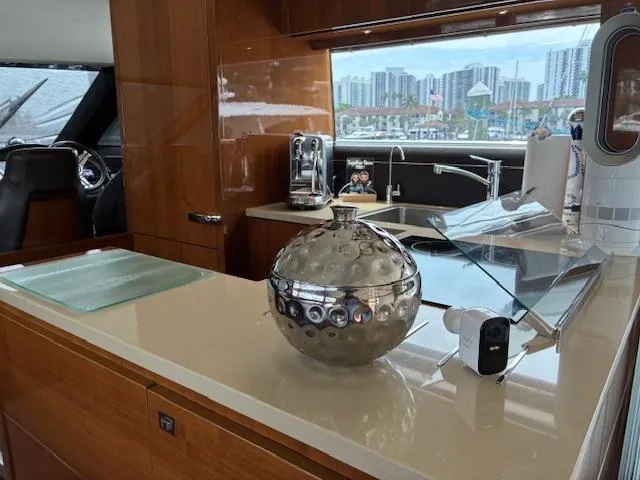 Mv Dream Yacht Photos Pics Luxurious 2012 Viking Princess Fly yacht interior with modern kitchen and cityscape view.
