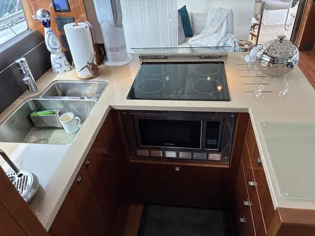 Mv Dream Yacht Photos Pics Modern kitchen in 2012 Viking Princess Fly yacht with stove, microwave, and sink.