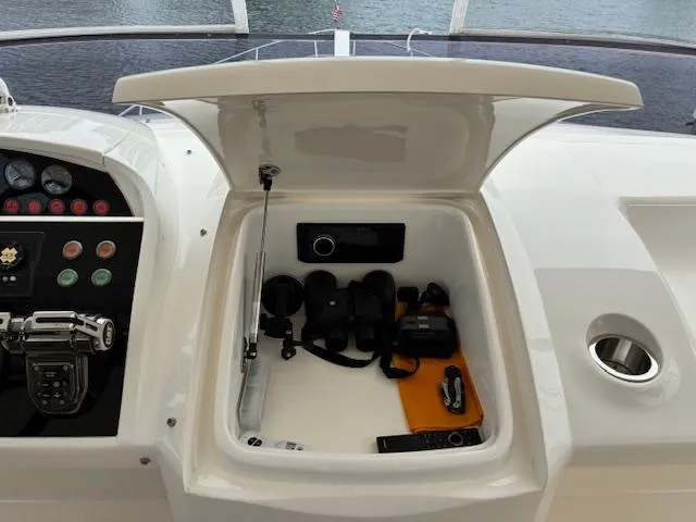 Mv Dream Yacht Photos Pics Open storage compartment on 2012 Viking Princess Fly yacht with navigation equipment.