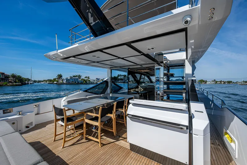  Yacht Photos Pics 2019 Azimut S7 yacht with outdoor dining area and scenic water view.