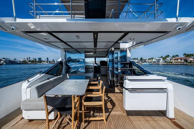  Yacht Photos Pics 2019 Azimut S7 yacht deck with dining area, modern design, and ocean view.
