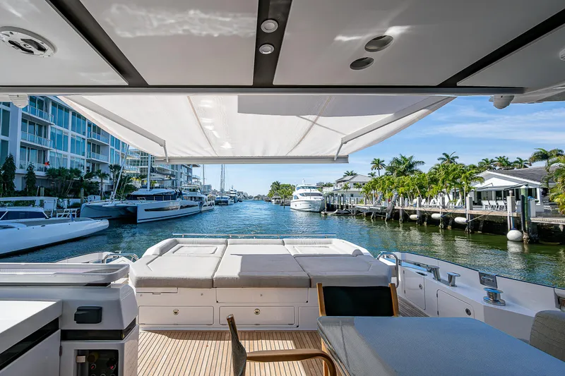  Yacht Photos Pics 2019 Azimut S7 yacht with spacious deck, docked in a scenic marina.