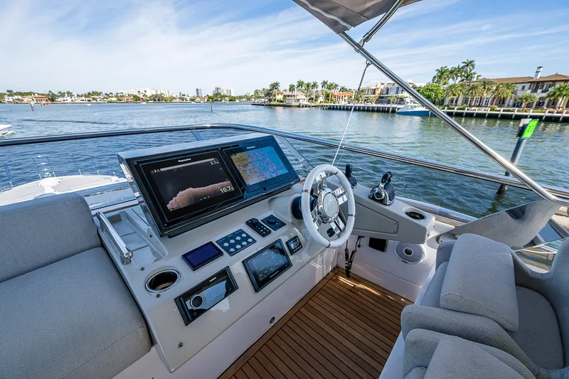  Yacht Photos Pics 2019 Azimut S7 yacht helm with modern navigation system and waterfront view.