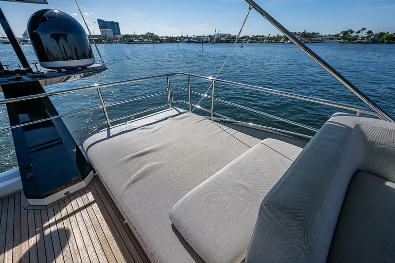  Yacht Photos Pics Luxurious 2019 Azimut S7 yacht deck with sunbed overlooking serene waters.