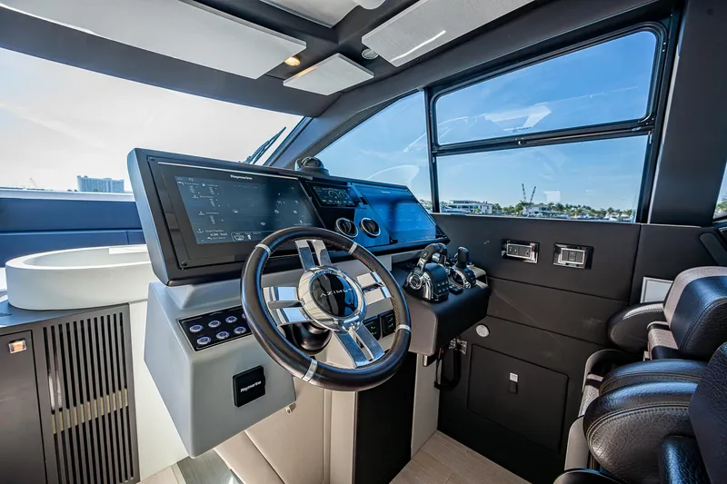  Yacht Photos Pics 2019 Azimut S7 yacht cockpit with modern steering wheel and advanced navigation controls.