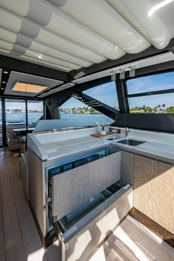  Yacht Photos Pics Luxurious interior of 2019 Azimut S7 yacht with modern kitchen and scenic views.