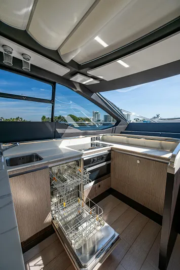  Yacht Photos Pics 2019 Azimut S7 yacht kitchen with modern appliances and open dishwasher.