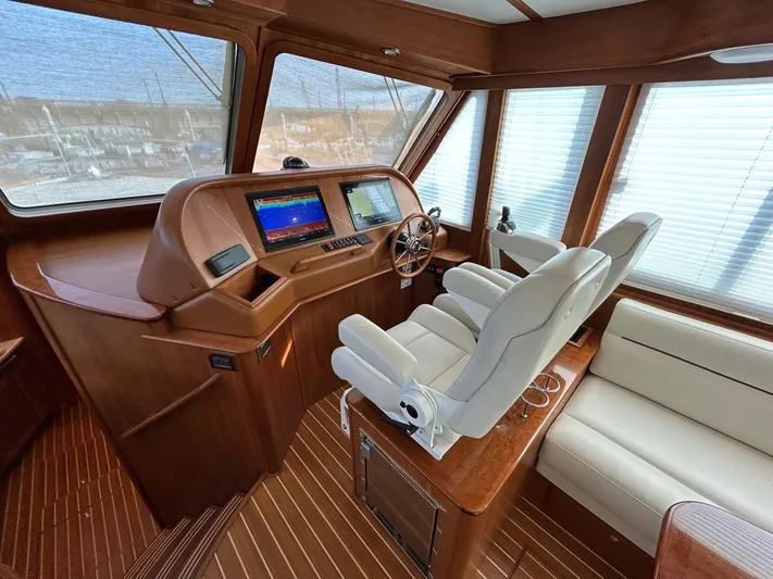 Fil The Tide Yacht Photos Pics Interior of 2021 Sabre 48 Salon Express yacht with modern helm and seating.