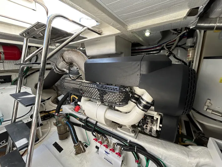 Fil The Tide Yacht Photos Pics Engine room of 2021 Sabre 48 Salon Express with visible machinery and piping.