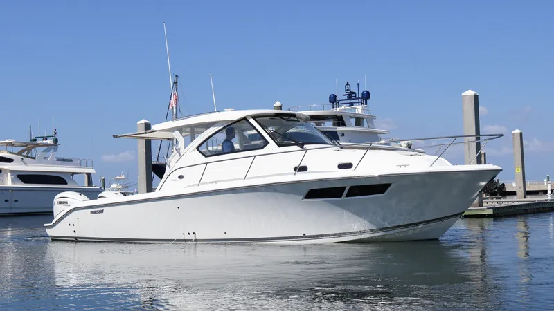  Yacht Photos Pics 2023 Pursuit OS 355 Offshore boat docked in marina under clear blue sky.