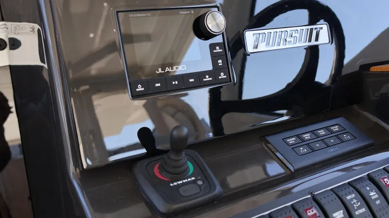  Yacht Photos Pics Control panel of 2023 Pursuit OS 355 Offshore boat with JL Audio system.