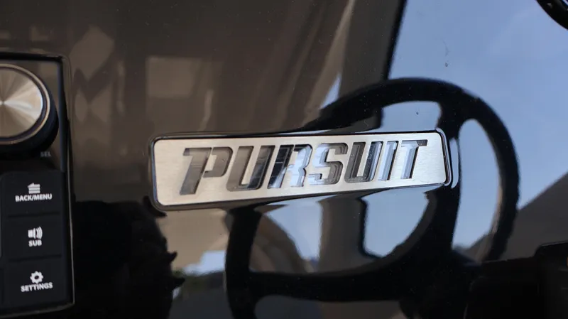  Yacht Photos Pics 2023 Pursuit OS 355 Offshore dashboard with logo and control panel.