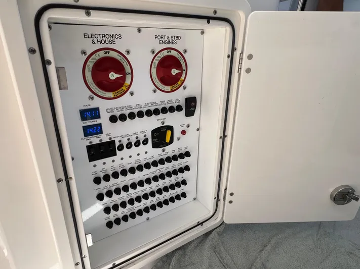  Yacht Photos Pics Control panel of 2023 Pursuit OS 355 Offshore boat, featuring electronics and engine switches.