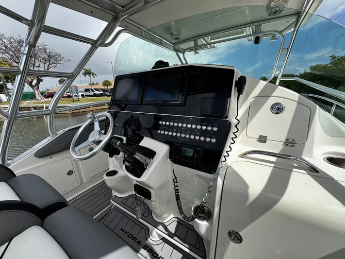  Yacht Photos Pics 2005 Hydra-Sports 3300 VX boat cockpit with modern controls and steering wheel.