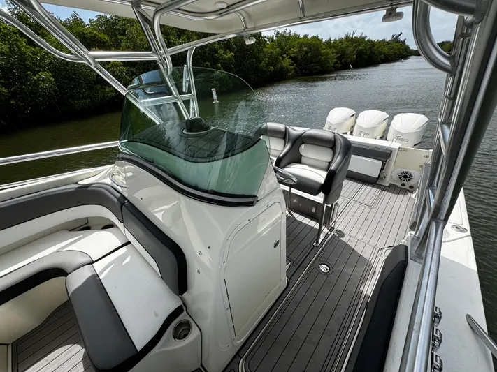  Yacht Photos Pics 2005 Hydra-Sports 3300 VX boat interior with seating and triple outboard motors.