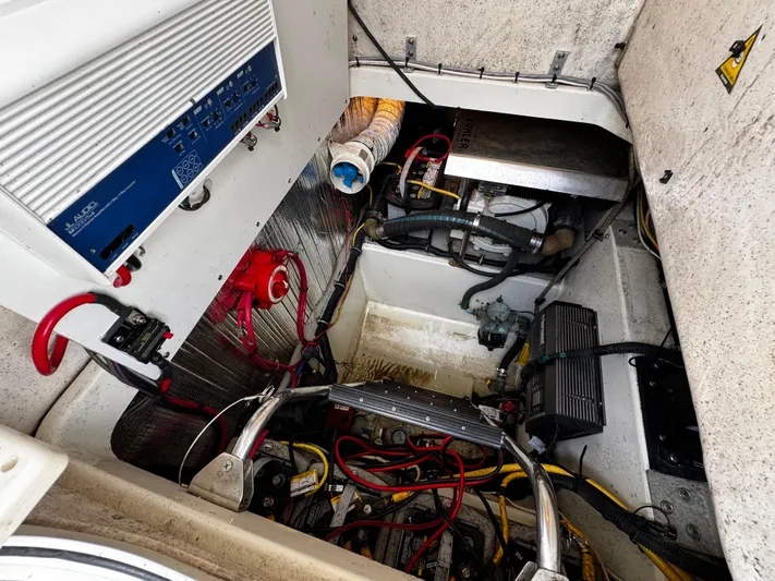  Yacht Photos Pics Engine compartment of a 2005 Hydra-Sports 3300 VX boat, showcasing wiring and components.